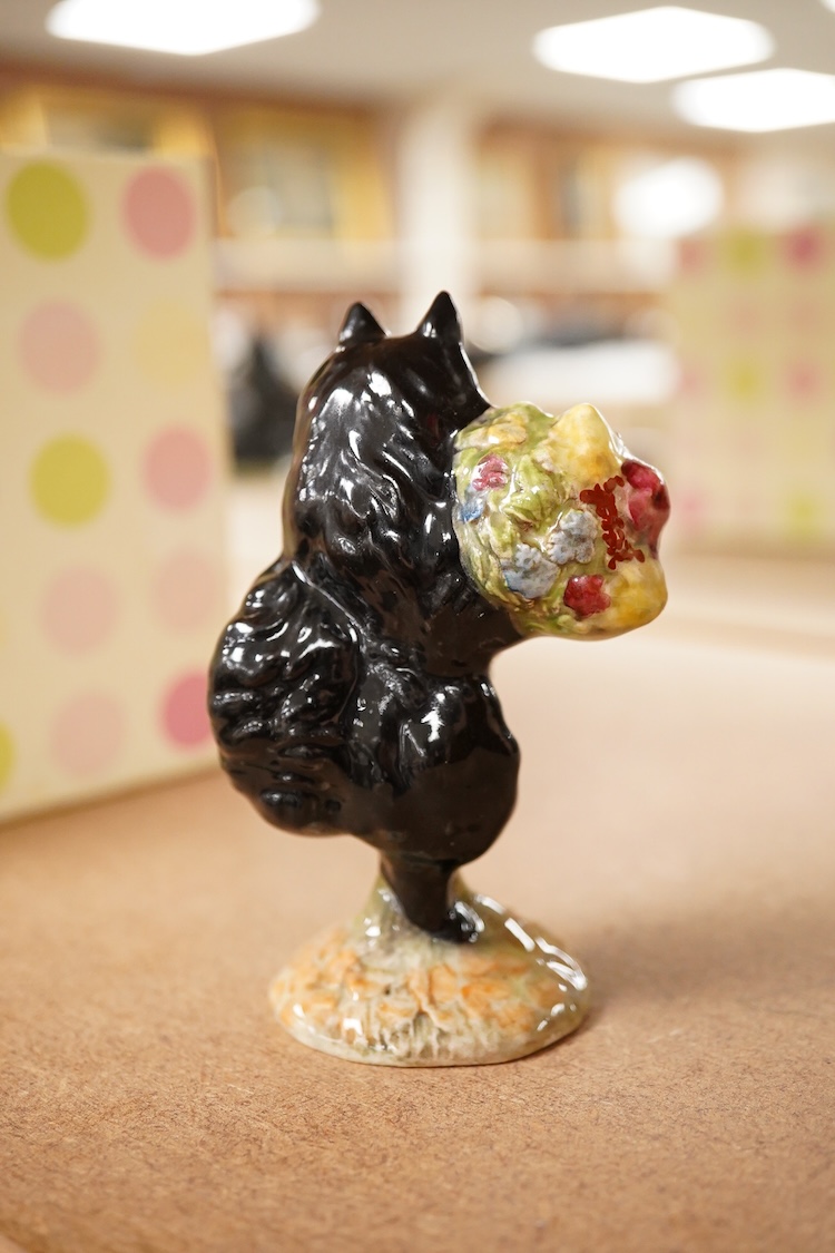 A Beatrix Potter, stamped F Warne and Co Ltd, Beswick figure of “Duchess” with flowers,10cm high